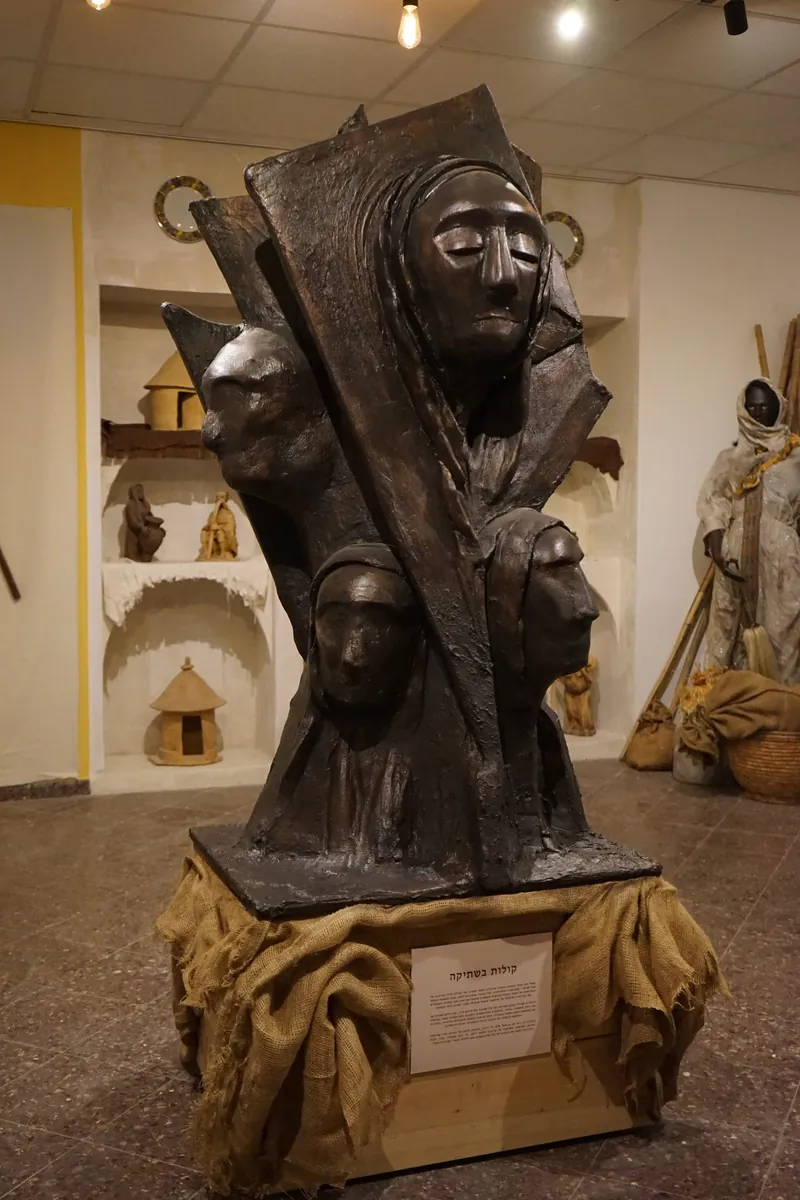 Bronze sculpted figures in a national Ethiopian Jewish heritage room by Shidrah Studio