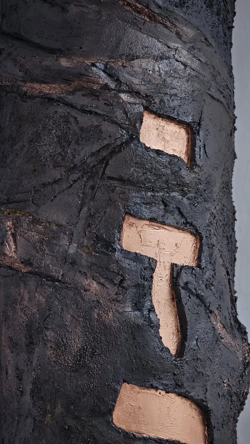 Carved relief with copper Hebrew lettering from an Ethiopian Jewish heritage room