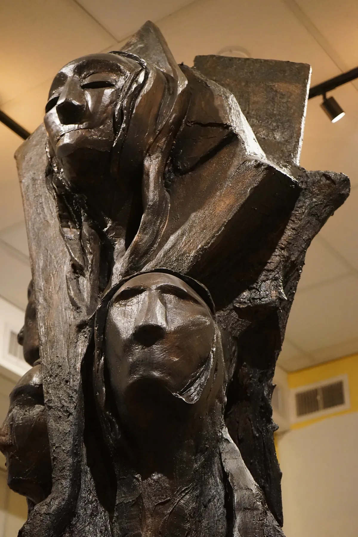 Museum-quality bronze sculpted faces from a Shidrah Studio Ethiopian Jewish heritage room